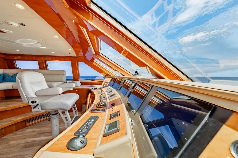  Yacht Photos Pics Luxurious 2009 Hargrave Raised Pilothouse interior with panoramic ocean views and modern controls.
