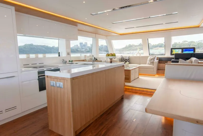 53f Iliad 2026 Yacht Photos Pics Luxurious interior of 2026 ILIAD 53F yacht with modern kitchen and panoramic windows.