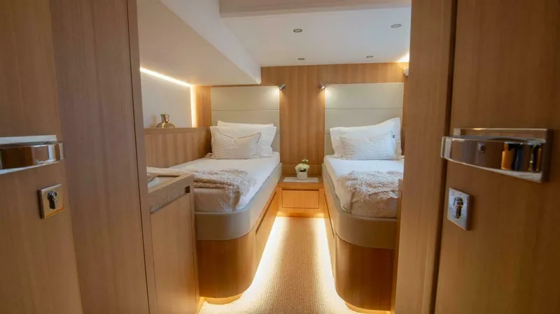 53f Iliad 2026 Yacht Photos Pics Luxurious twin cabin interior on ILIAD 53F yacht, 2026 model, with modern wood finish.