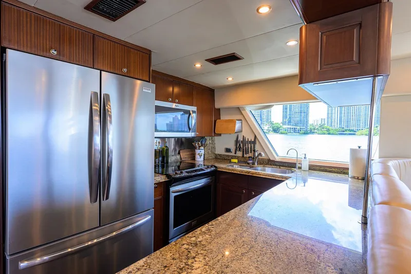 Jule Yacht Photos Pics Luxurious kitchen interior of 2005 Pacific Mariner 85 yacht with modern appliances and waterfront view.