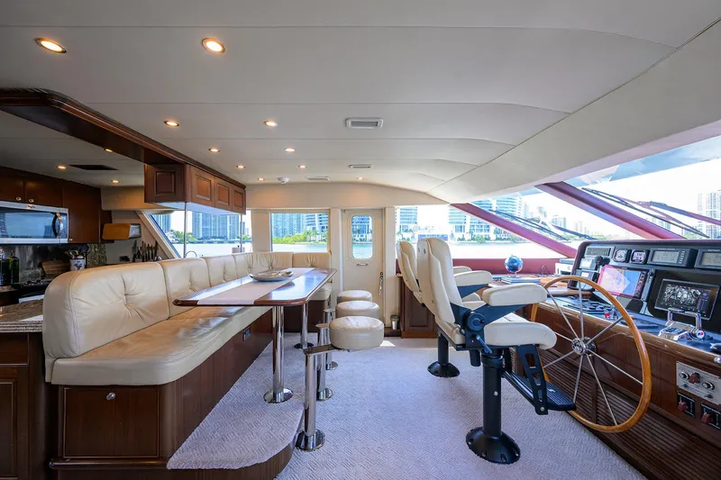 Jule Yacht Photos Pics Luxurious interior of 2005 Pacific Mariner 85 yacht with plush seating and modern helm.