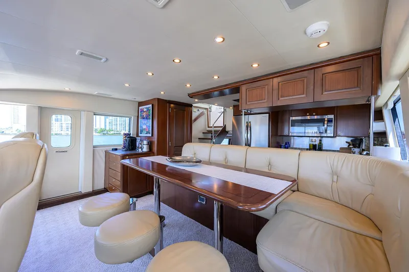 Jule Yacht Photos Pics Luxurious interior of 2005 Pacific Mariner 85 yacht with elegant dining area and modern kitchen.