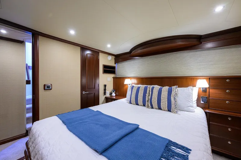 Jule Yacht Photos Pics Luxurious bedroom interior of 2005 Pacific Mariner 85 yacht with elegant bedding and lighting.