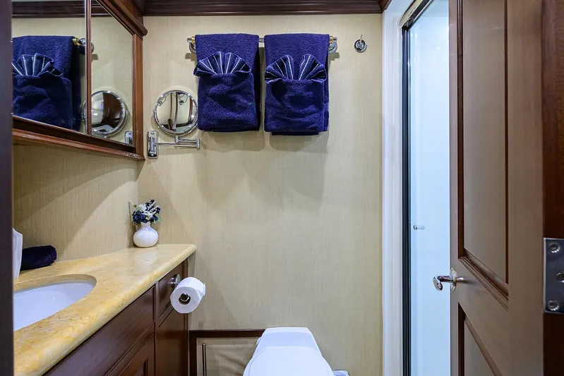Jule Yacht Photos Pics Luxurious bathroom in 2005 Pacific Mariner 85 yacht with elegant decor and plush towels.