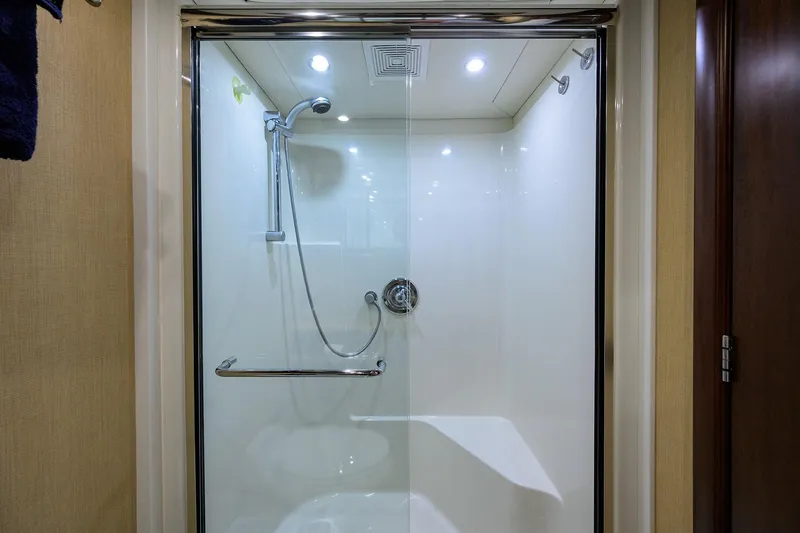 Jule Yacht Photos Pics Luxurious shower in 2005 Pacific Mariner 85 yacht, featuring modern fixtures and glass door.