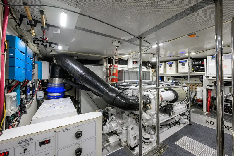 Jule Yacht Photos Pics Engine room of a 2005 Pacific Mariner 85 yacht, featuring advanced machinery and equipment.