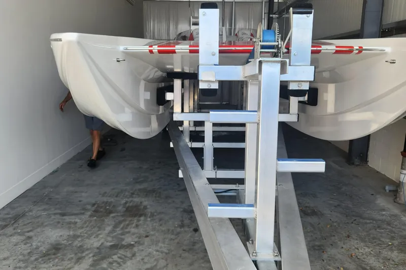  Yacht Photos Pics 2022 HellCat 32 Wide Body boat on trailer in storage facility.