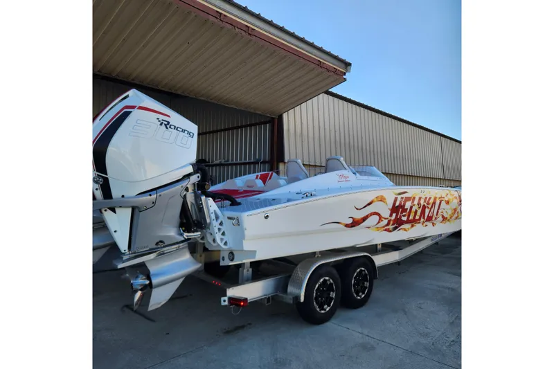  Yacht Photos Pics 2022 HellCat 32 Wide Body boat with racing engine, parked on a trailer.