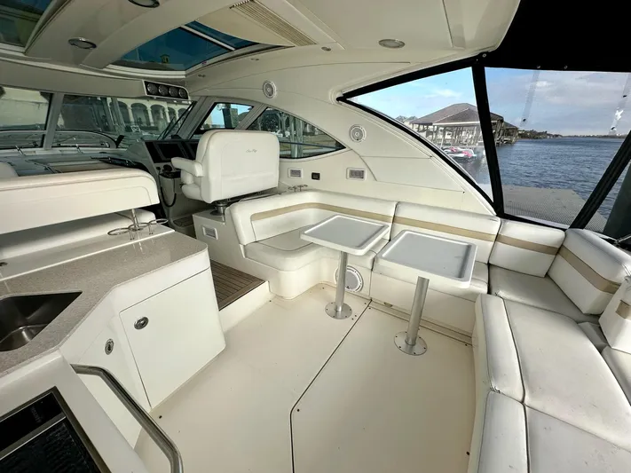 Be A Blessing II Yacht Photos Pics Luxurious interior of 2009 Sea Ray 4300 Sundancer yacht with seating and tables.