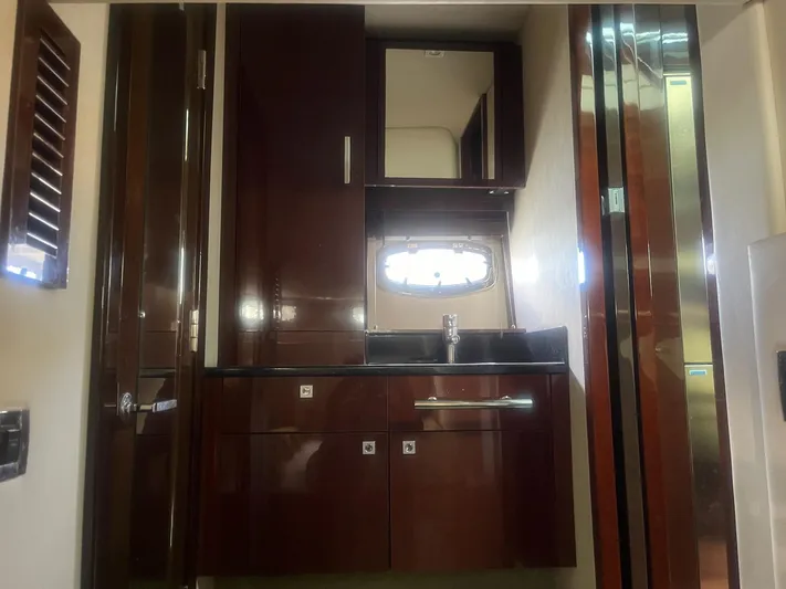Be A Blessing II Yacht Photos Pics Luxurious bathroom interior of 2009 Sea Ray 4300 Sundancer yacht with wooden cabinetry.