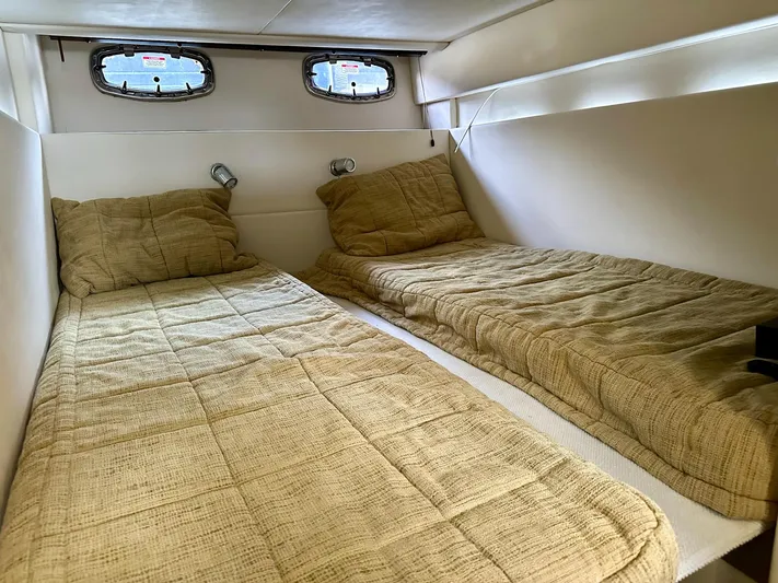 Be A Blessing II Yacht Photos Pics Interior cabin of 2009 Sea Ray 4300 Sundancer with twin beds and beige bedding.