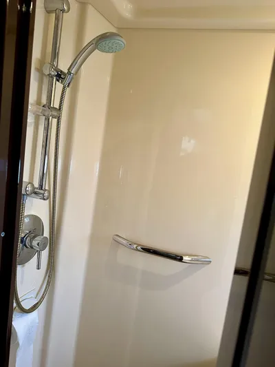 Be A Blessing II Yacht Photos Pics Shower area in 2009 Sea Ray 4300 Sundancer yacht, featuring chrome fixtures and handheld showerhead.