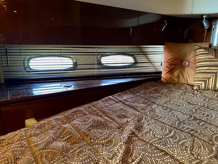 Be A Blessing II Yacht Photos Pics Luxurious cabin interior of 2009 Sea Ray 4300 Sundancer yacht with patterned bedding.