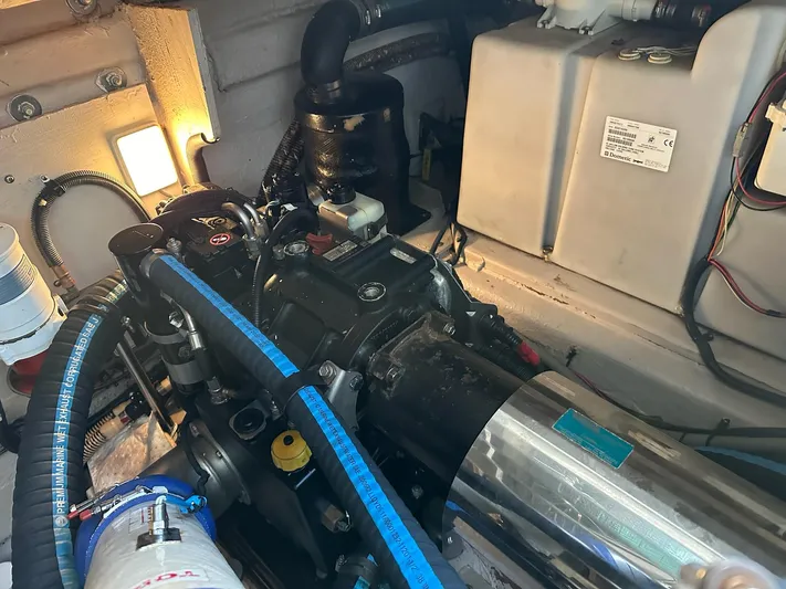 Be A Blessing II Yacht Photos Pics Engine room of 2009 Sea Ray 4300 Sundancer, showcasing mechanical components and wiring.