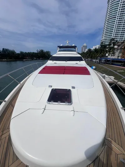  Yacht Photos Pics Azimut Leonardo 98 yacht, 2004 model, docked near modern buildings and waterfront.