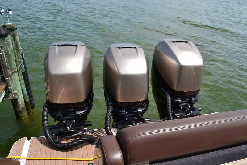  Yacht Photos Pics 2016 Mystic Powerboats M4200 with triple outboard engines on water.