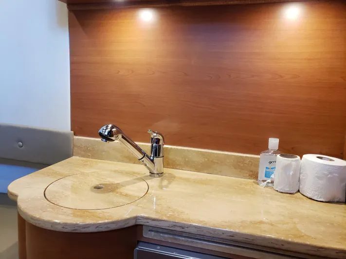  Yacht Photos Pics Luxurious 2016 Mystic Powerboats M4200 interior with elegant sink and countertop.