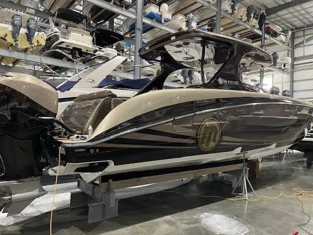  Yacht Photos Pics 2016 Mystic Powerboats M4200 in storage, sleek design, luxury motorboat.