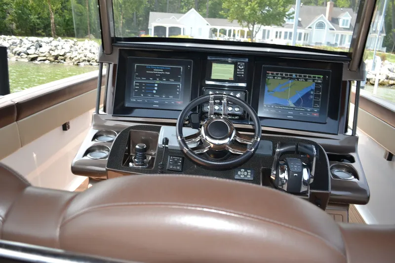  Yacht Photos Pics Cockpit of 2016 Mystic Powerboats M4200 with advanced navigation displays and controls.