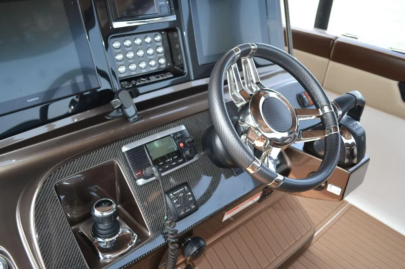 Yacht Photos Pics 2016 Mystic Powerboats M4200 helm with modern controls and sleek steering wheel.