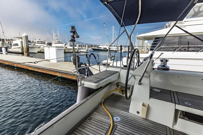 Blue Sky Yacht Photos Pics 2012 Beneteau Sense 50 yacht docked at marina, showcasing helm and deck area.