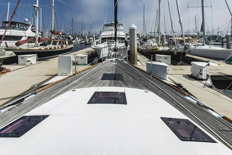 Blue Sky Yacht Photos Pics 2012 Beneteau Sense 50 yacht docked at a marina, surrounded by other boats.
