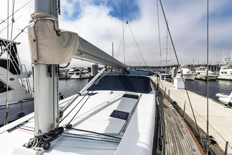 Blue Sky Yacht Photos Pics 2012 Beneteau Sense 50 sailboat docked at a marina, showcasing sleek design and spacious deck.