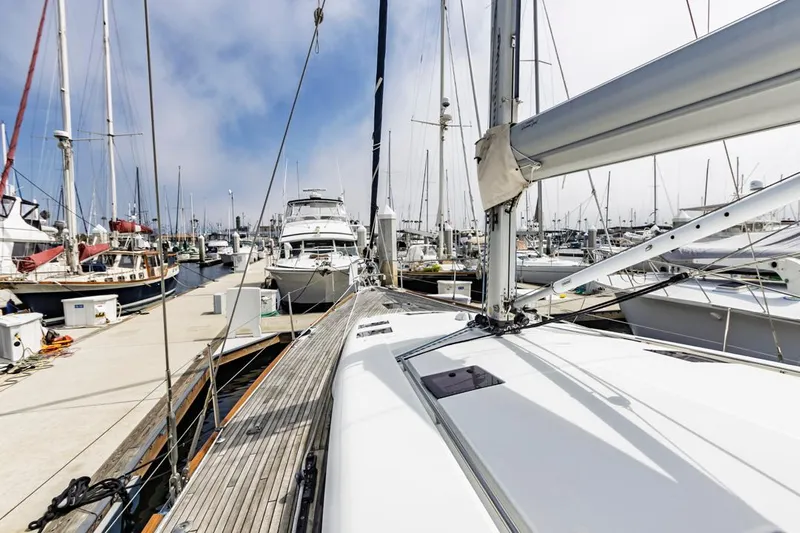 Blue Sky Yacht Photos Pics 2012 Beneteau Sense 50 yacht docked in a marina, surrounded by other boats.