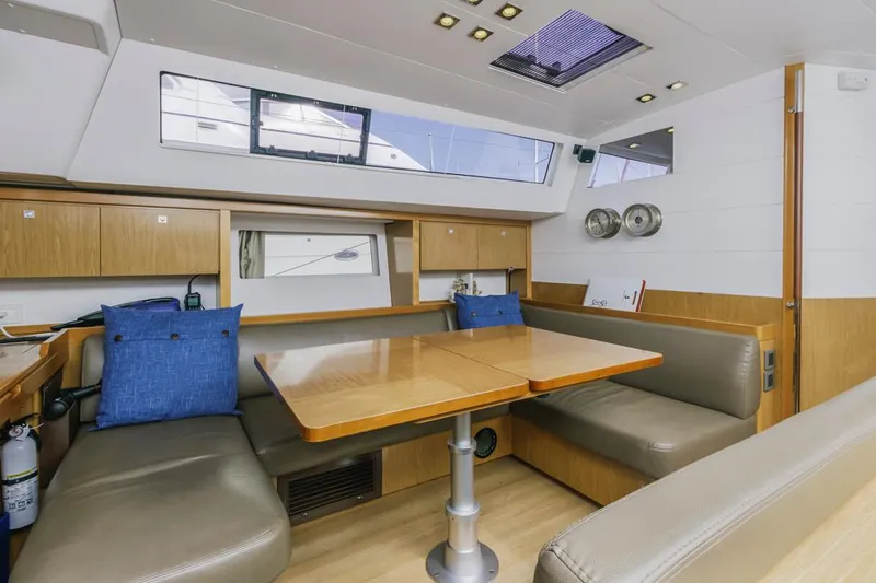 Blue Sky Yacht Photos Pics Interior of 2012 Beneteau Sense 50 yacht with modern dining area and seating.