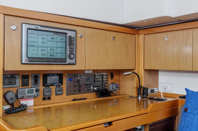 Blue Sky Yacht Photos Pics Navigation station of 2012 Beneteau Sense 50 yacht with control panel and instruments.