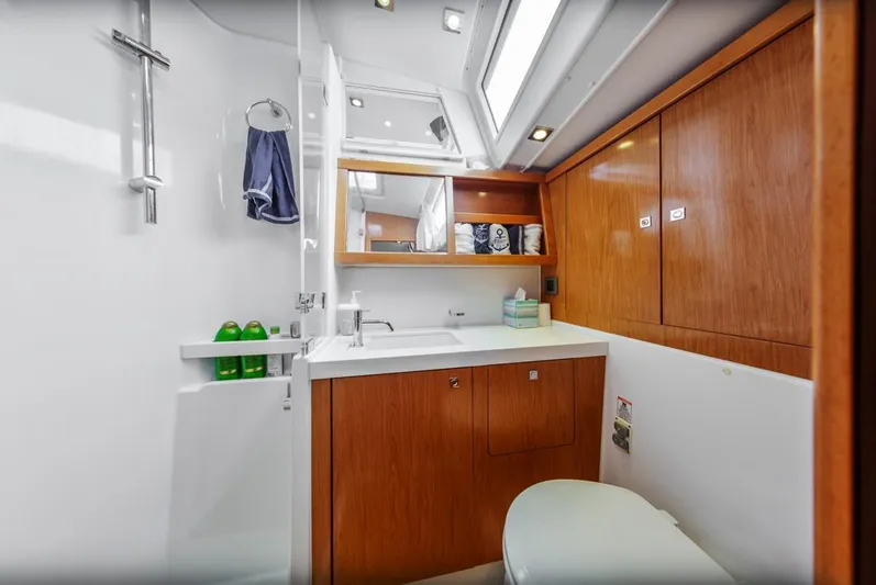 Blue Sky Yacht Photos Pics Luxurious bathroom interior of 2012 Beneteau Sense 50 yacht with wooden cabinetry.