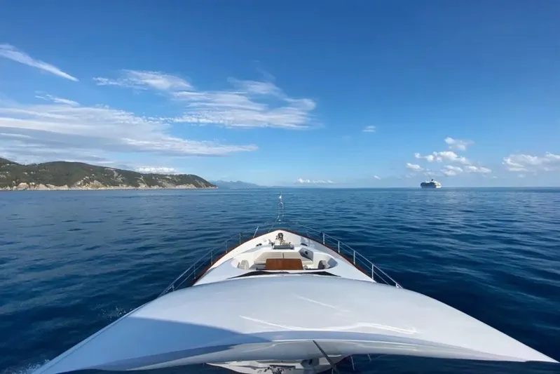  Yacht Photos Pics Maiora 24S yacht cruising on open sea, 2015 model, with scenic coastal view.