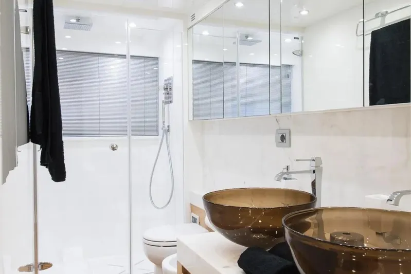  Yacht Photos Pics Luxurious bathroom in 2015 Maiora 24S yacht with glass sinks and modern shower.