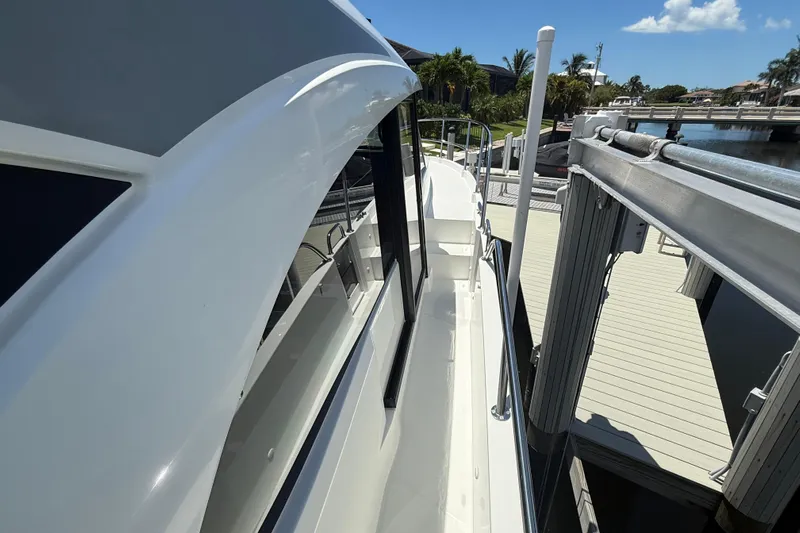  Yacht Photos Pics 2024 Beneteau Antares 11 yacht docked, showcasing sleek design and modern features.