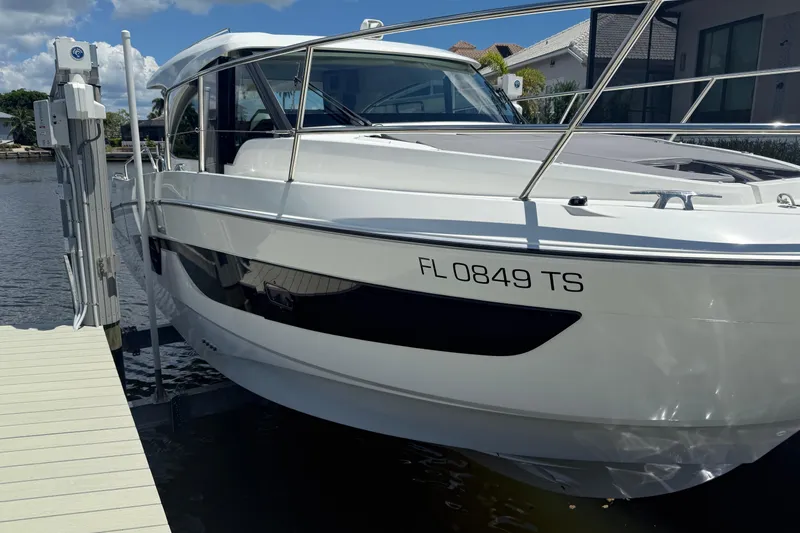  Yacht Photos Pics 2024 Beneteau Antares 11 docked, showcasing sleek design and modern features.