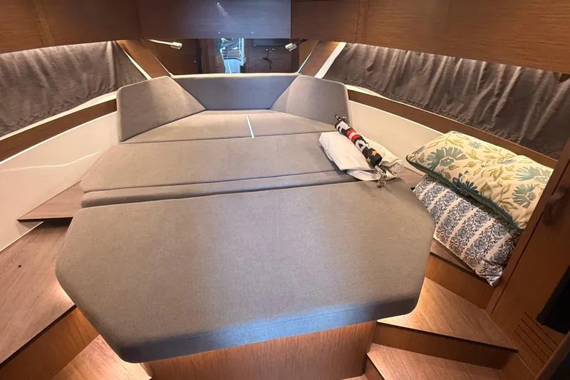  Yacht Photos Pics Luxurious cabin interior of 2024 Beneteau Antares 11 with cozy bedding and modern design.