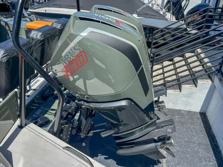  Yacht Photos Pics 2024 BRABUS Shadow 1000XC outboard motor in sleek design, docked at marina.