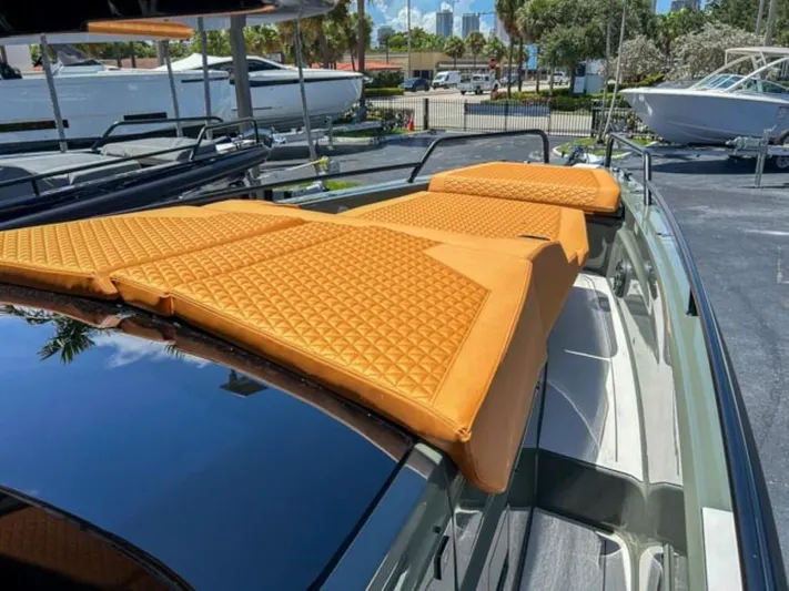  Yacht Photos Pics 2024 BRABUS Shadow 1000XC luxury yacht with orange cushioned sun deck.