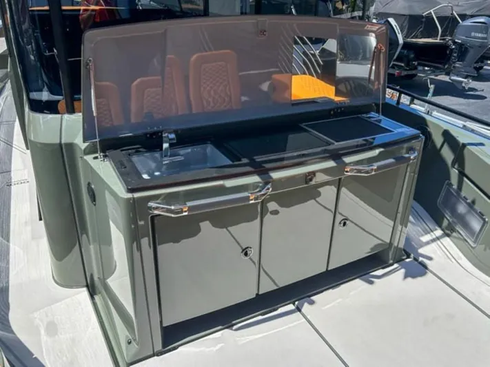  Yacht Photos Pics 2024 BRABUS Shadow 1000XC boat kitchen area with sleek design and modern amenities.