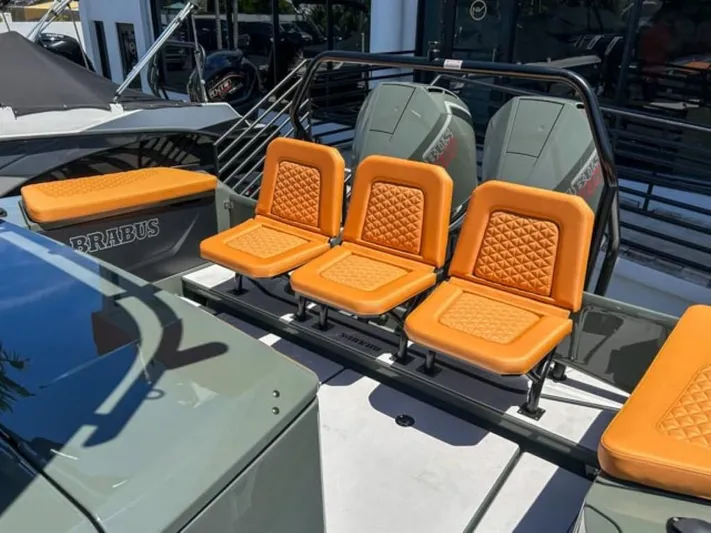  Yacht Photos Pics 2024 BRABUS Shadow 1000XC boat with orange quilted seats and sleek design.