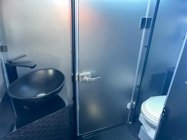  Yacht Photos Pics Luxurious bathroom interior of 2024 BRABUS Shadow 1000XC with modern sink and toilet.