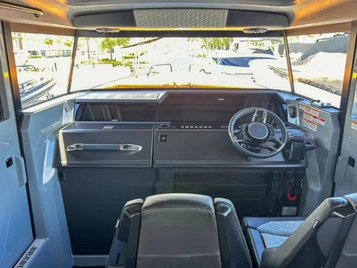  Yacht Photos Pics 2024 BRABUS Shadow 1000XC boat interior with modern steering and dashboard.