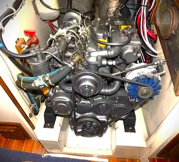 Vital Spark Yacht Photos Pics Engine compartment of a 1995 Pacific Seacraft 37 sailboat, showcasing mechanical components.