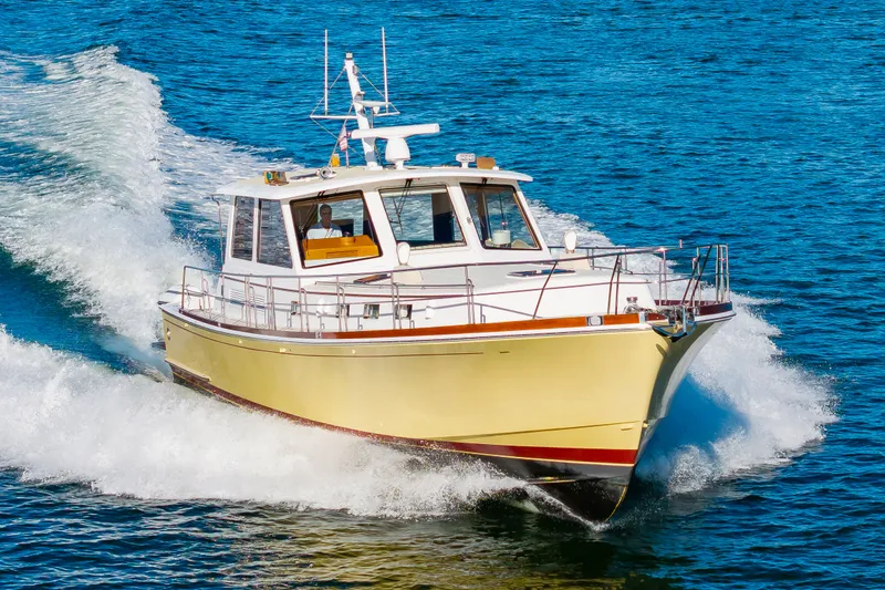 I Freedom I Yacht Photos Pics 2005 Grand Banks 49 Eastbay SX yacht cruising on water.