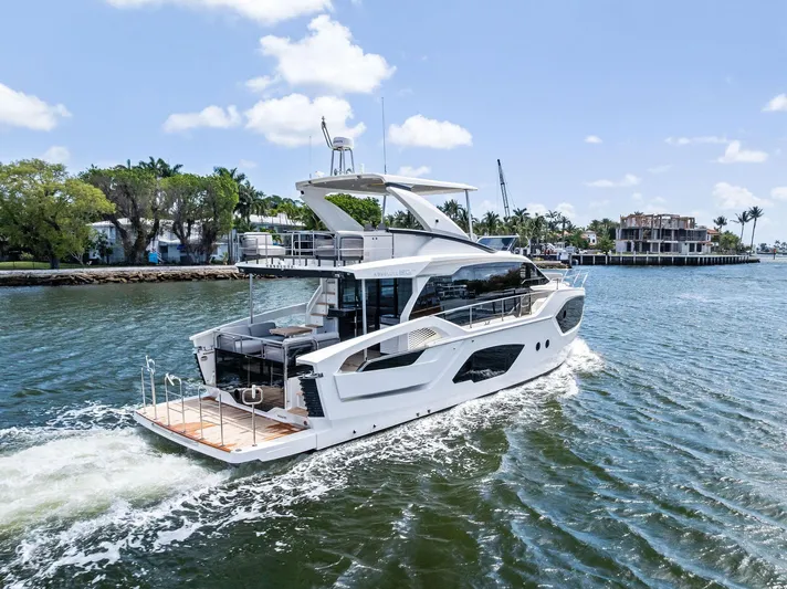 Lobster Tails Yacht Photos Pics Luxury Absolute 52 FLY yacht cruising on a sunny day, 2023 model.