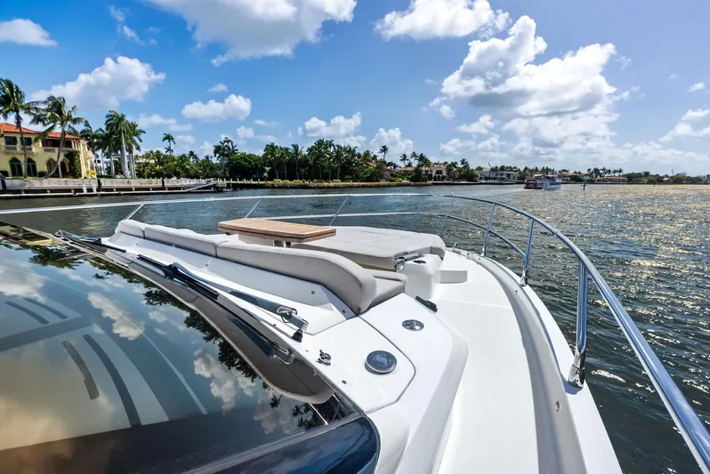 Lobster Tails Yacht Photos Pics Luxury Absolute 52 FLY yacht cruising on sunny waters, 2023 model.