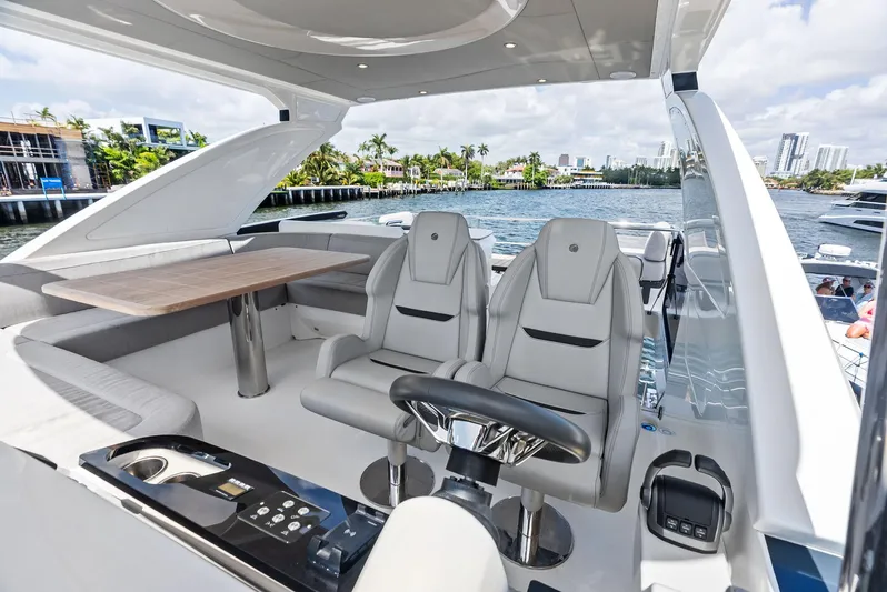 Lobster Tails Yacht Photos Pics Luxurious 2023 Absolute 52 FLY yacht interior with modern seating and waterfront view.