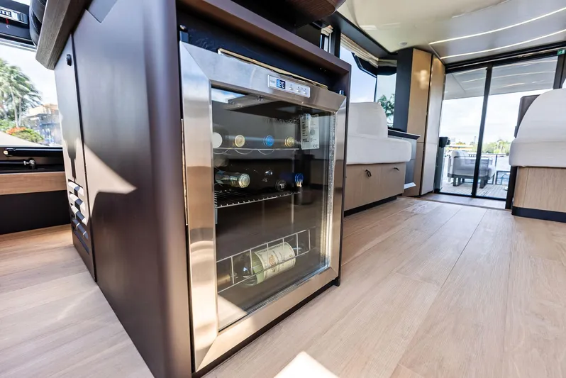 Lobster Tails Yacht Photos Pics Luxurious interior of 2023 Absolute 52 FLY yacht with modern wine cooler.