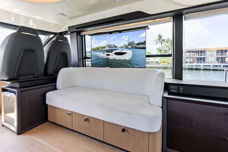 Lobster Tails Yacht Photos Pics Interior of 2023 Absolute 52 FLY yacht with modern seating and large windows.