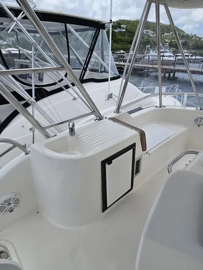  Yacht Photos Pics Flybridge of 2007 Riviera 42 yacht with marina view in background.